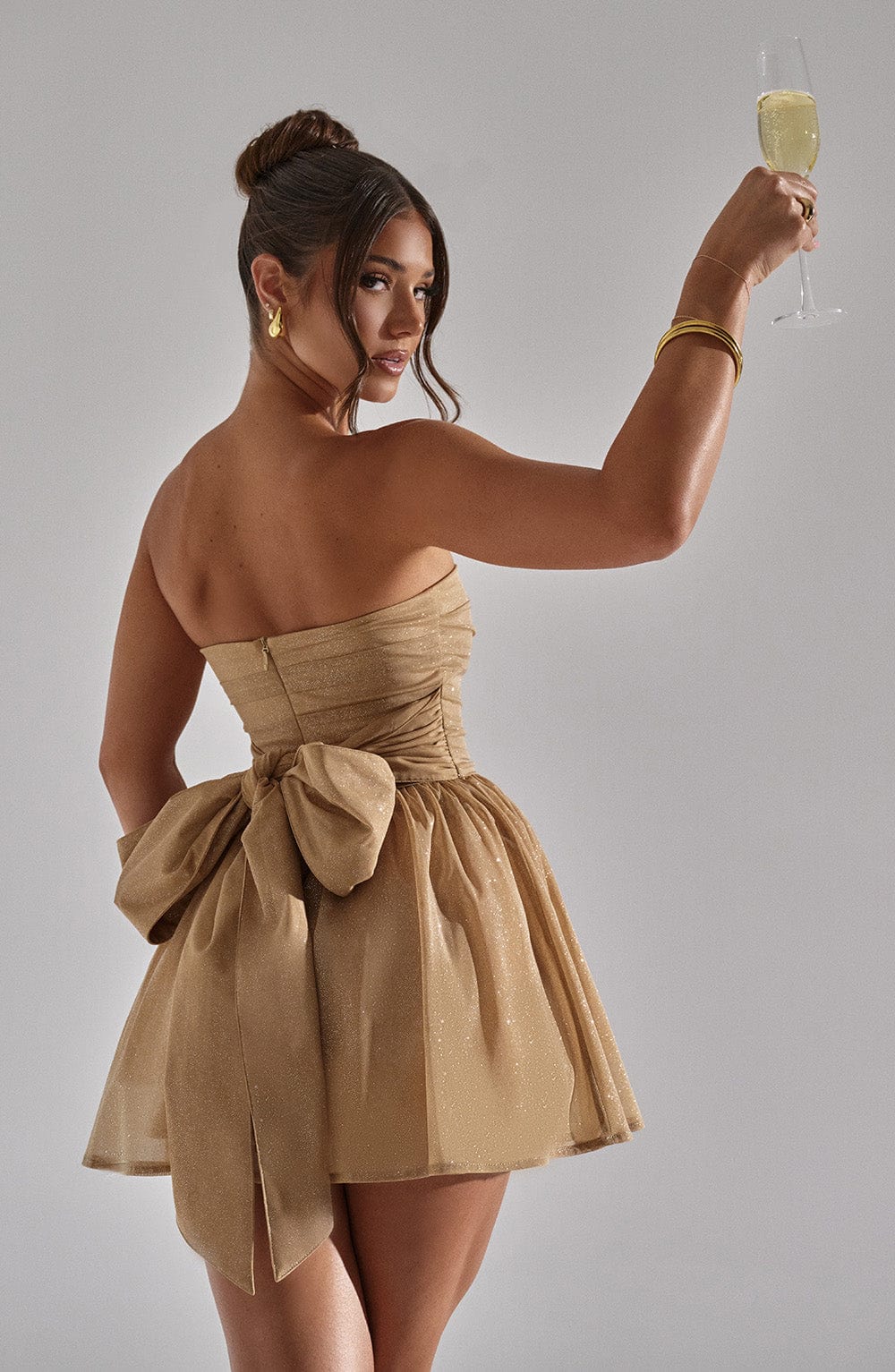 Beyond Chic | Back-Knot Strapless Glitter Mini Dress