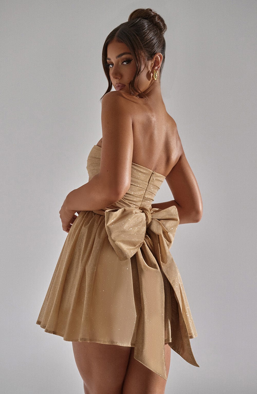 Beyond Chic | Back-Knot Strapless Glitter Mini Dress